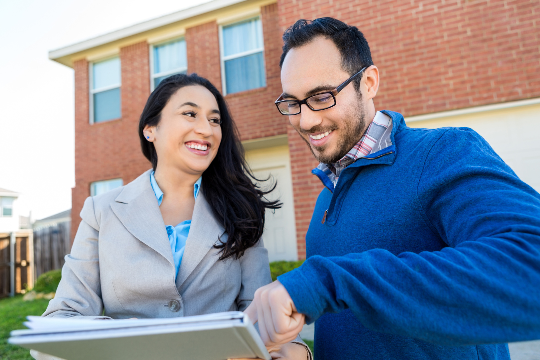 Potential client discusses home with realtor